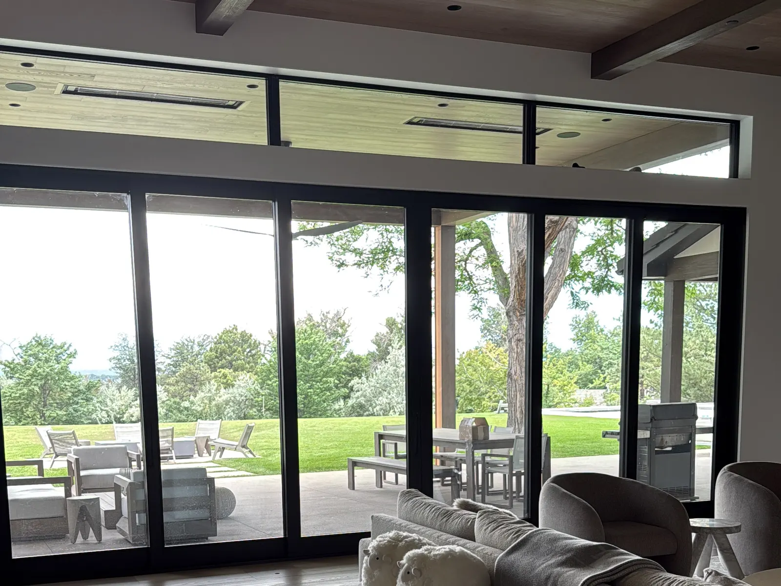 Bright, freshly cleaned modern living room with floor-to-ceiling windows in a Denver metro home